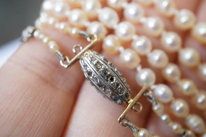 A natural pearl and diamond necklace, early 20th century